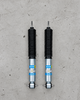 Bilstein B8 front shock absorbers for Mitsubishi Delica L300 with 4–6 inch lift, heavy-duty gas pressure shocks sold as a pair for lifted off-road suspension.