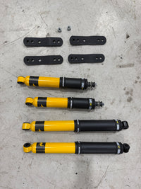  HiYota 2-inch lift kit for Toyota HiAce H200 2004–2018, including Old Man Emu shocks and HiYota extended greasable rear shackles.